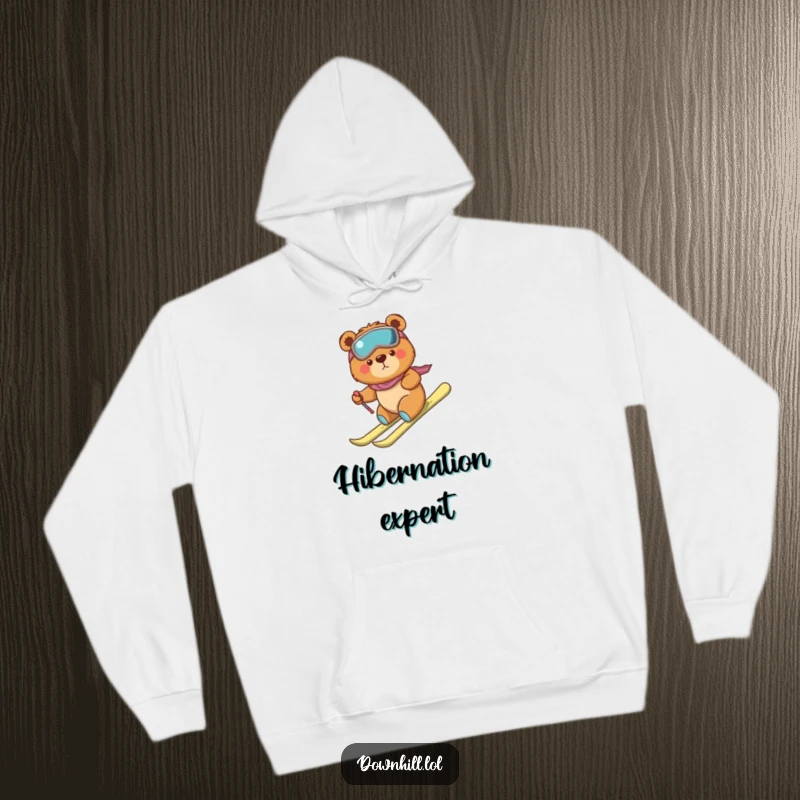 A cozy hoodie featuring a funny, determined bear cub in skis, making a brave but clumsy descent down a snowy slope.